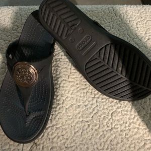 black croc sandals, size 8, worn once, gold medallion in the center.